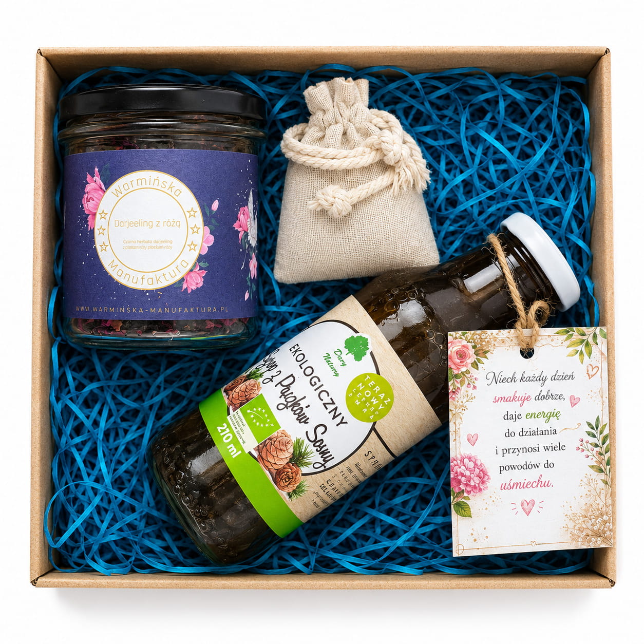 Ekologiczny zestaw prezentowy z herbatą Darjeeling z różą i syropem z pąków sosny to wyjątkowy upominek dla miłośników naturalnych produktów. Eleganckie pudełko kraftowe, ozdobne wypełnienie i dekoracyjna zawieszka.
